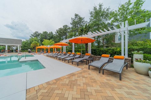 Sparkling swimming pool and spacious sundeck at The Oxmoor in Birmingham, AL